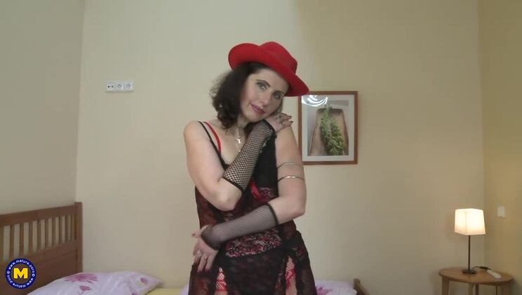 Mature housewife Darlena plays with her toys